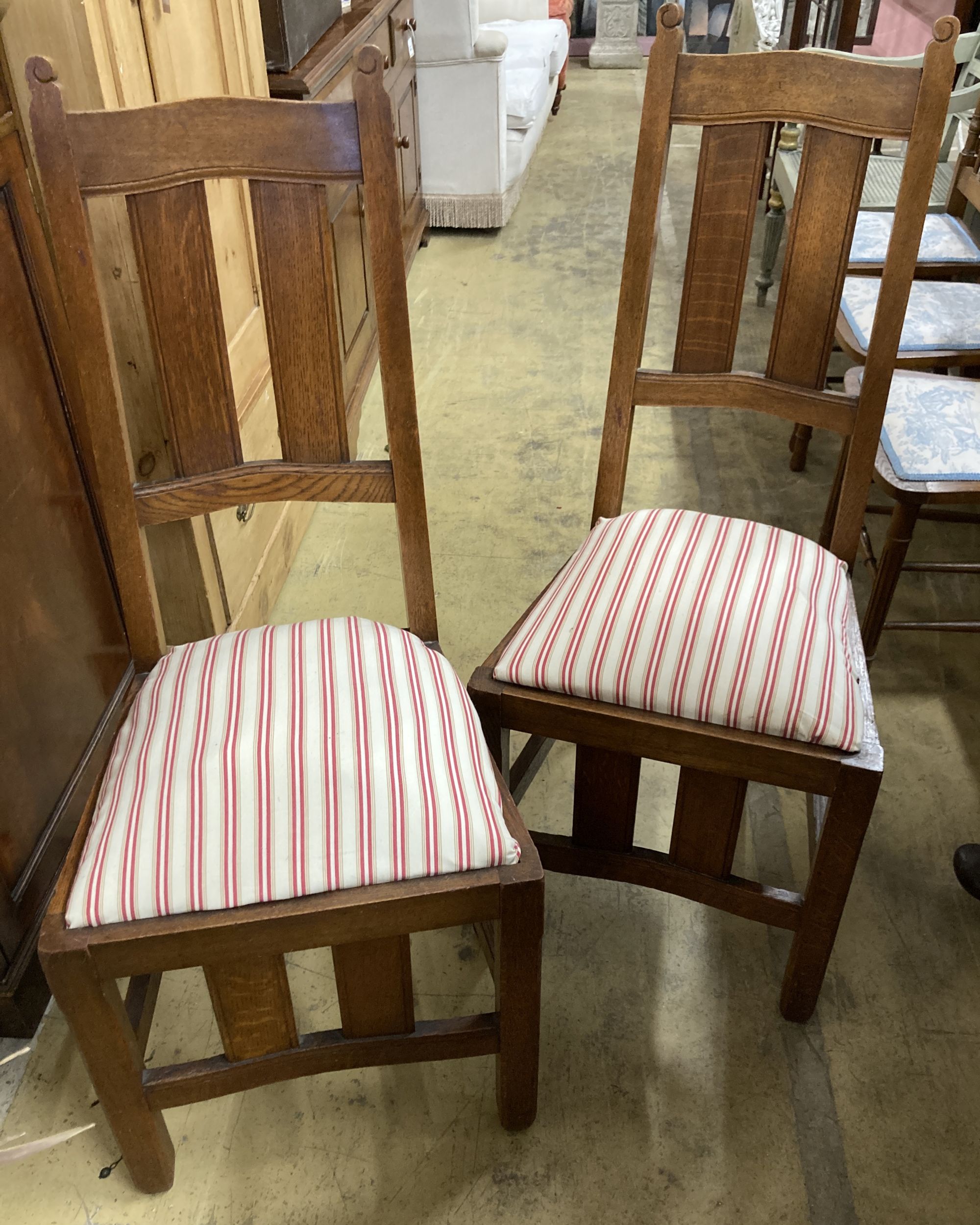 A set of six early 20th century oak Arts & Crafts style dining chairs